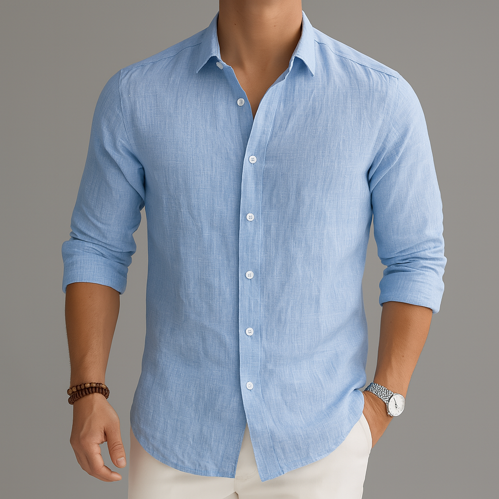 Men's light blue linen button-up shirt with white buttons, rolled sleeves, slim fit, styled with white pants and a watch.