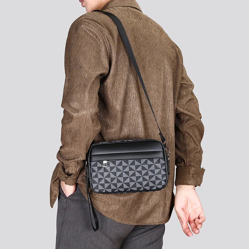 Man wearing a black geometric checkered crossbody bag with adjustable strap over a brown textured shirt