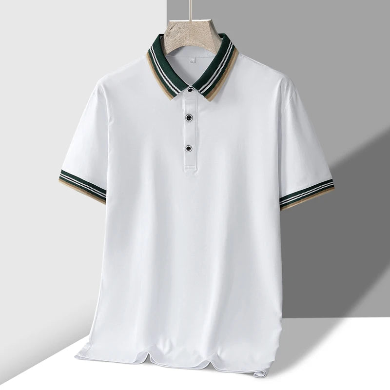 White men's polo shirt with green and tan striped collar and cuffs, two snap buttons, short sleeves, on hanger