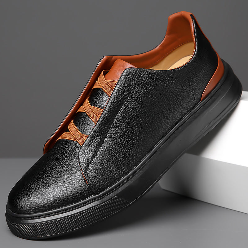 Black leather slip-on sneakers with tan brown contrast trim and elastic laces for men casual footwear