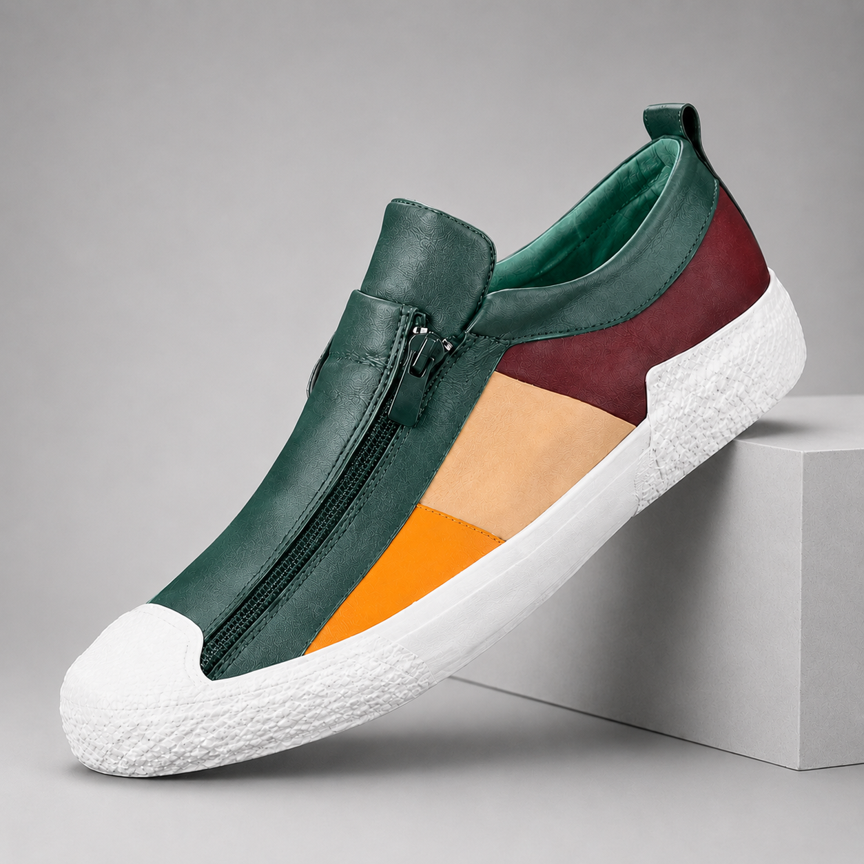Colorblock leather slip-on sneakers for women with front zipper closure and white rubber sole in green burgundy orange