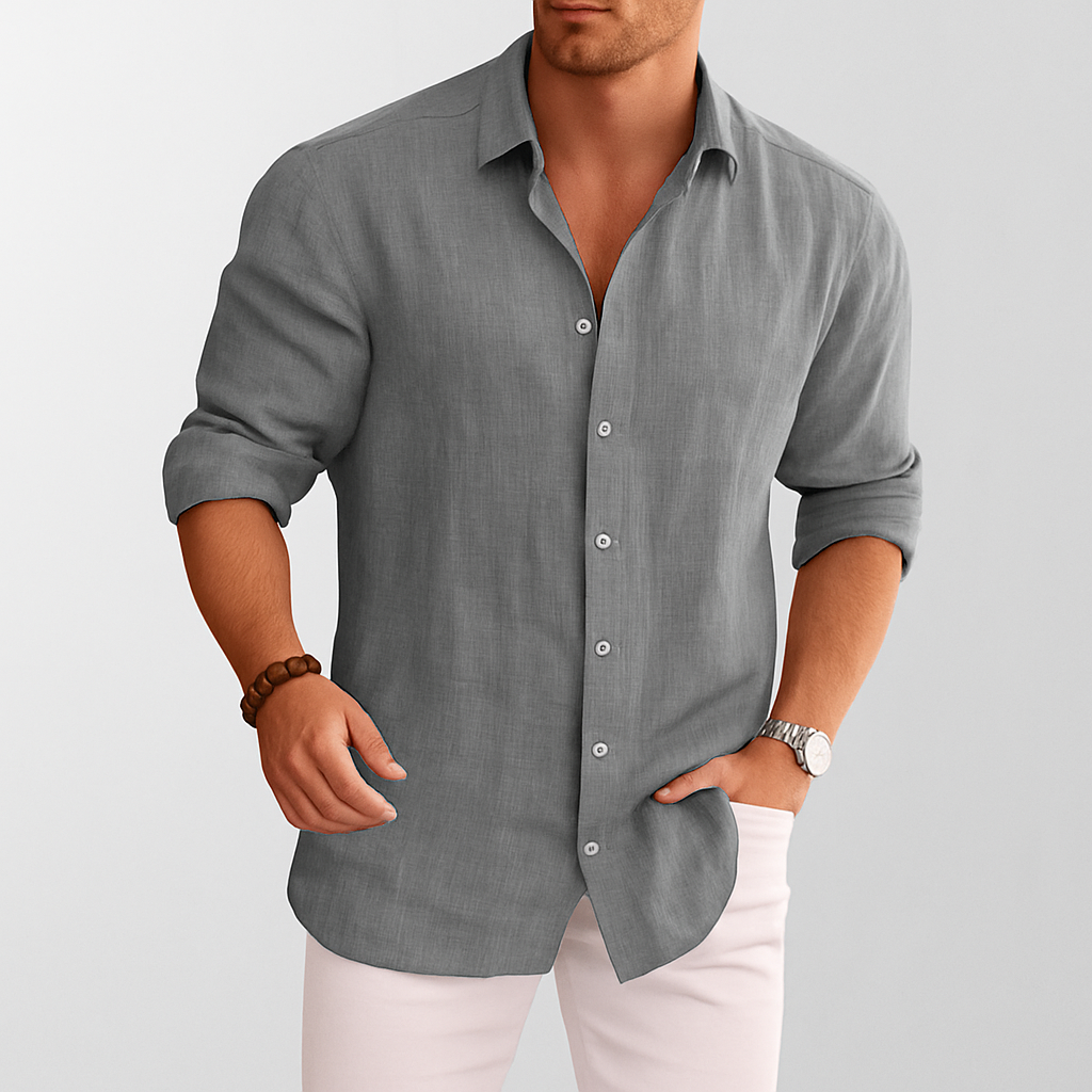 Men's gray linen button-up shirt with rolled sleeves styled with white pants and watch
