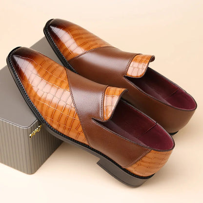Men's brown leather slip-on loafers with crocodile embossed texture and burgundy lining on beige background