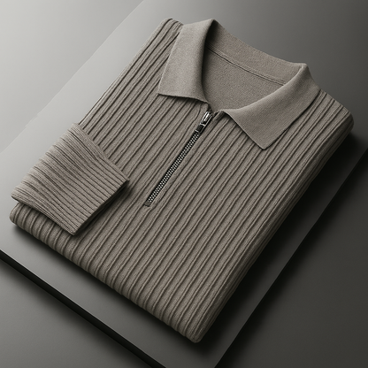 Folded men's taupe ribbed cotton quarter-zip sweater with polo collar and silver zipper on dark surface