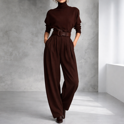 Women's chocolate brown turtleneck sweater and wide-leg pleated pants set with leather belt and heeled boots