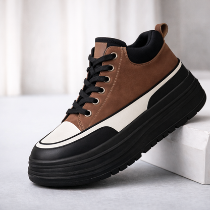 Brown and black platform sneakers with chunky sole, white toe cap, and black laces for women's casual streetwear fashion