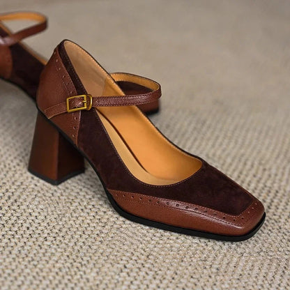 Brown two-tone leather Mary Jane pumps with square toe, block heel, ankle strap, and gold buckle detail