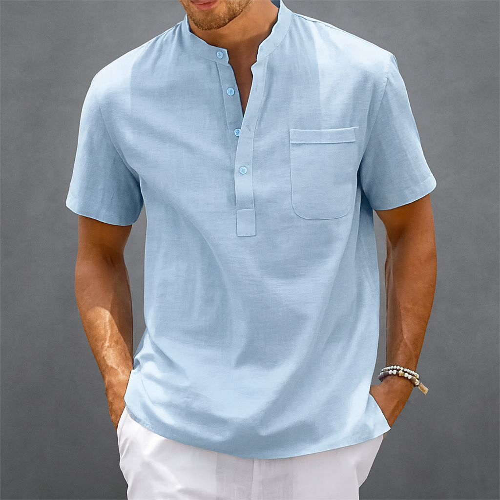 Men's light blue linen short-sleeve Henley shirt with band collar, chest pocket, and three-button placket.