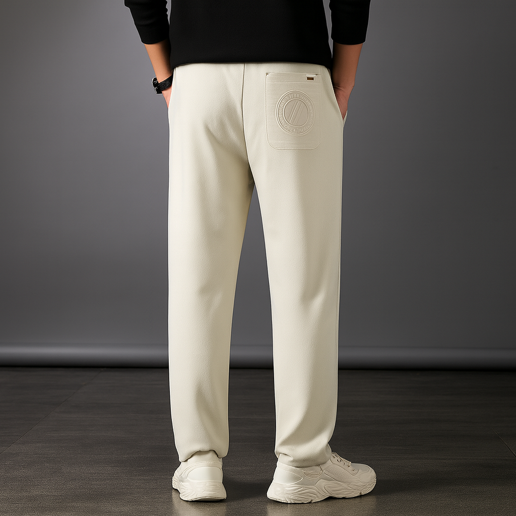 Men's cream ice silk drawstring sweatpants with embossed circular logo pocket detail and relaxed straight leg fit