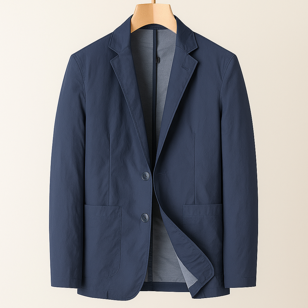 Navy blue nylon two-button men's blazer with notch lapels, patch pockets, and gray lining, displayed on a wooden hanger.