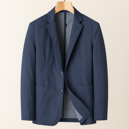 Navy blue nylon two-button men's blazer with notch lapels, patch pockets, and gray lining, displayed on a wooden hanger.