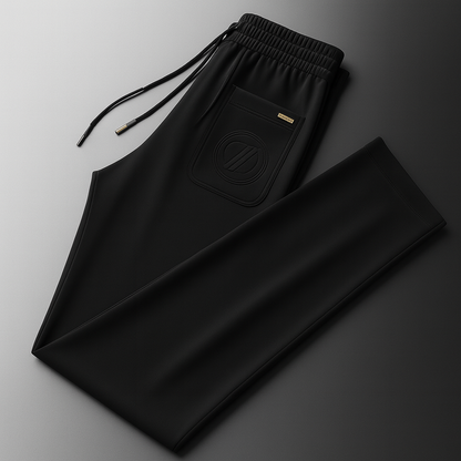 Black ice silk men's drawstring sweatpants with embossed logo pocket, elastic waistband, and gold hardware detail.