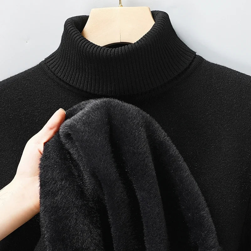 Black men's merino wool turtleneck sweater displayed on mannequin with hand showing soft fleece interior lining.