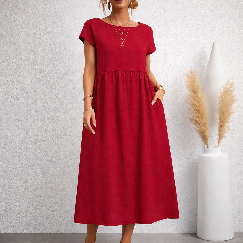 Women's red linen relaxed midi dress with short sleeves, smocked waist, side pockets, and A-line silhouette