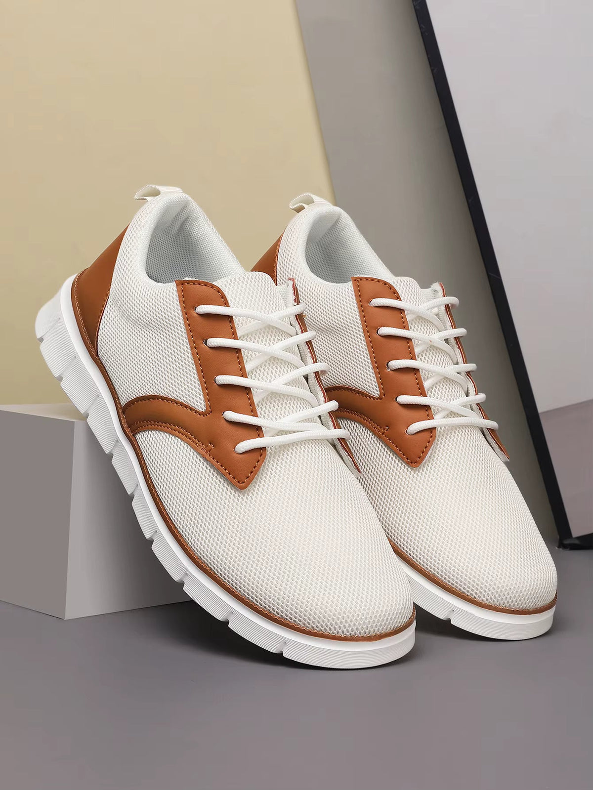 White canvas orthopedic sneakers with brown leather accents and white laces for women comfortable walking shoes