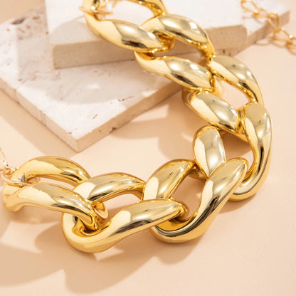 Chunky gold curb chain link choker necklace with oversized polished links, statement jewelry for women