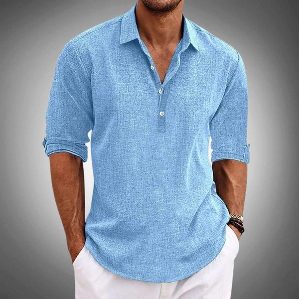 Men's light blue linen henley shirt with rolled sleeves and button placket paired with white pants