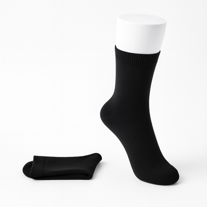 Black women's cashmere comfort crew socks shown on mannequin foot and flat, featuring ribbed cuff and reinforced toe.
