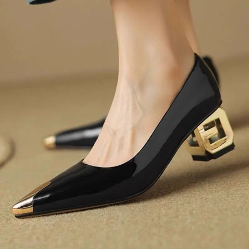 Black patent leather pointed toe pumps with gold metallic cap toe and decorative block heel for women