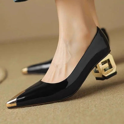 Black patent leather pointed toe pumps with gold metallic cap toe and decorative block heel for women