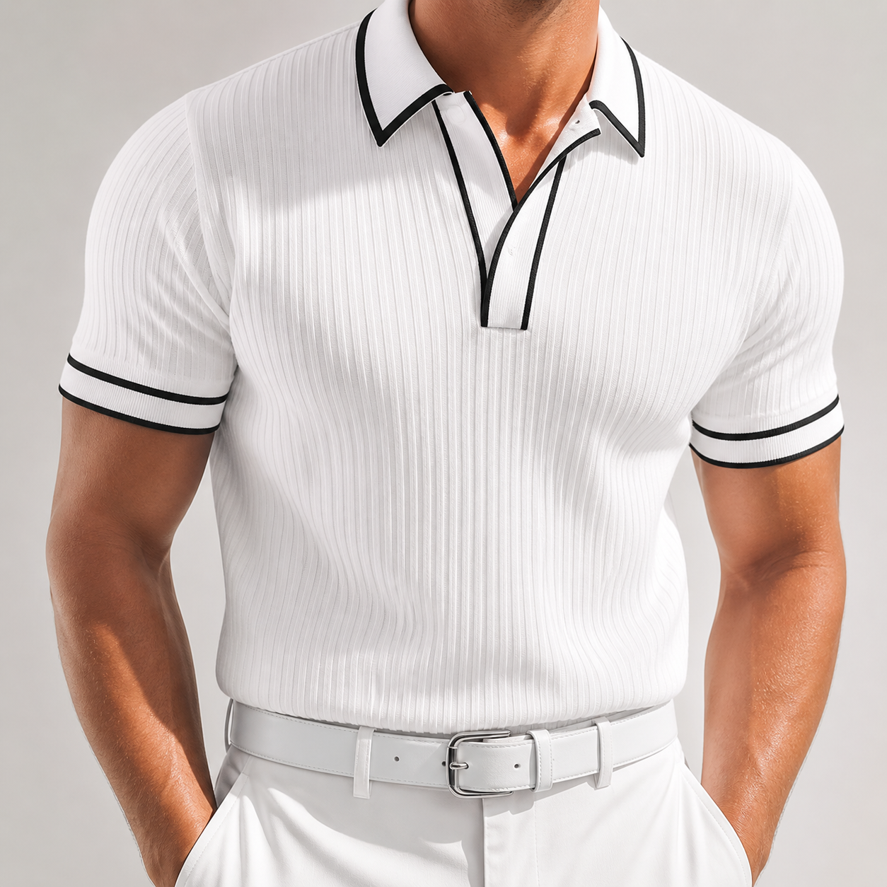 Men's white ribbed knit polo shirt with black contrast trim on collar, cuffs, and V-neckline, paired with white trousers.