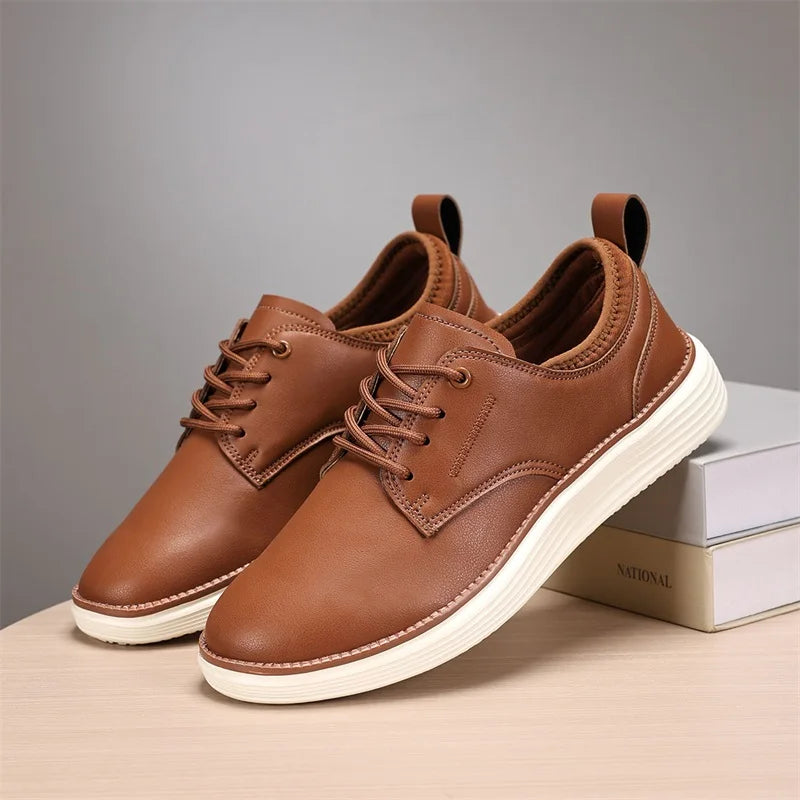Brown leather lace-up casual shoes for men with white sole and pull tab, displayed on books