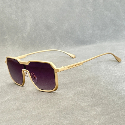 Gold square aviator sunglasses with gradient purple lenses and slim metal temples on gray background