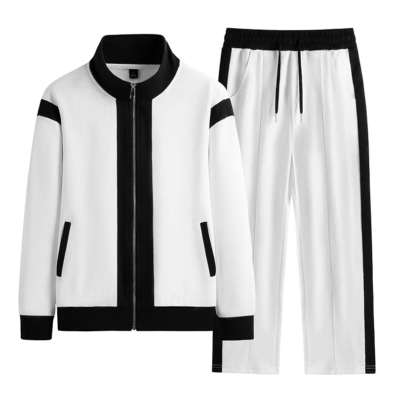 Men's white and black full-zip tracksuit set with jacket and jogger pants featuring contrast trim