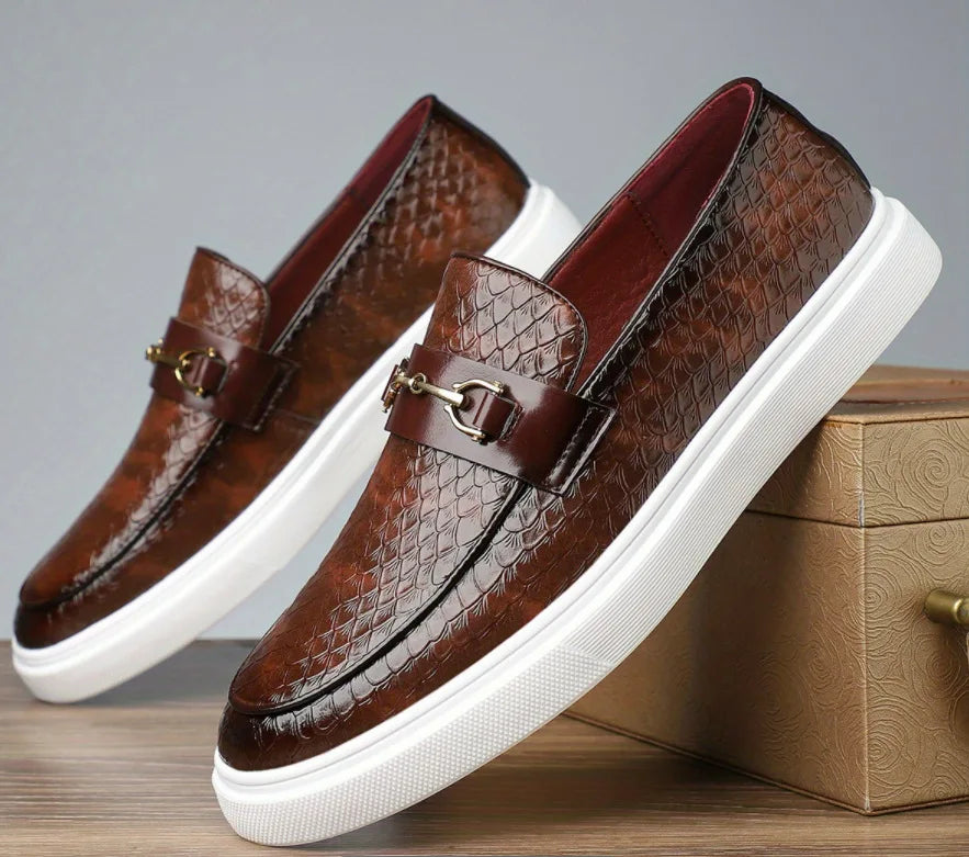 Brown leather slip-on loafers with gold buckle detail and white sole for men, crocodile embossed texture