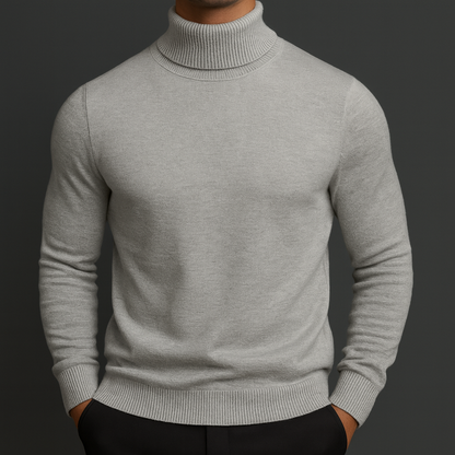 Men's light gray merino wool turtleneck sweater with ribbed collar, cuffs, and hem, slim fit, paired with black pants.