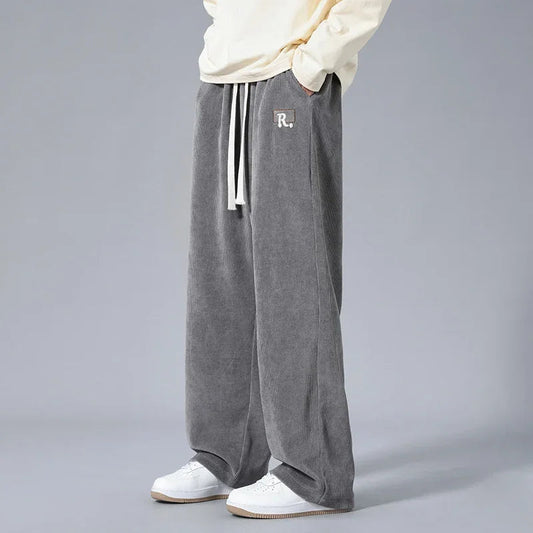 Men's gray wide-leg corduroy sweatpants with white drawstring and R logo patch, casual loose fit pants