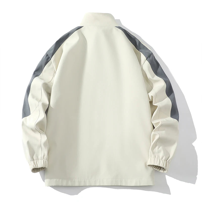 Men's cream and gray striped tracksuit jacket with elastic cuffs laid flat on white background