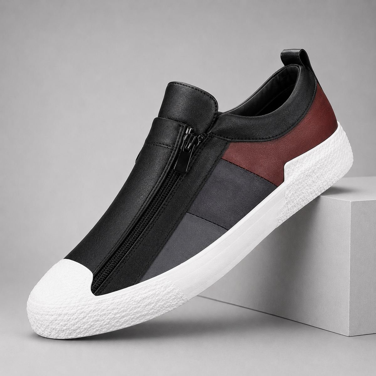 Black leather slip-on sneakers for women with zipper closure and burgundy accent on white sole