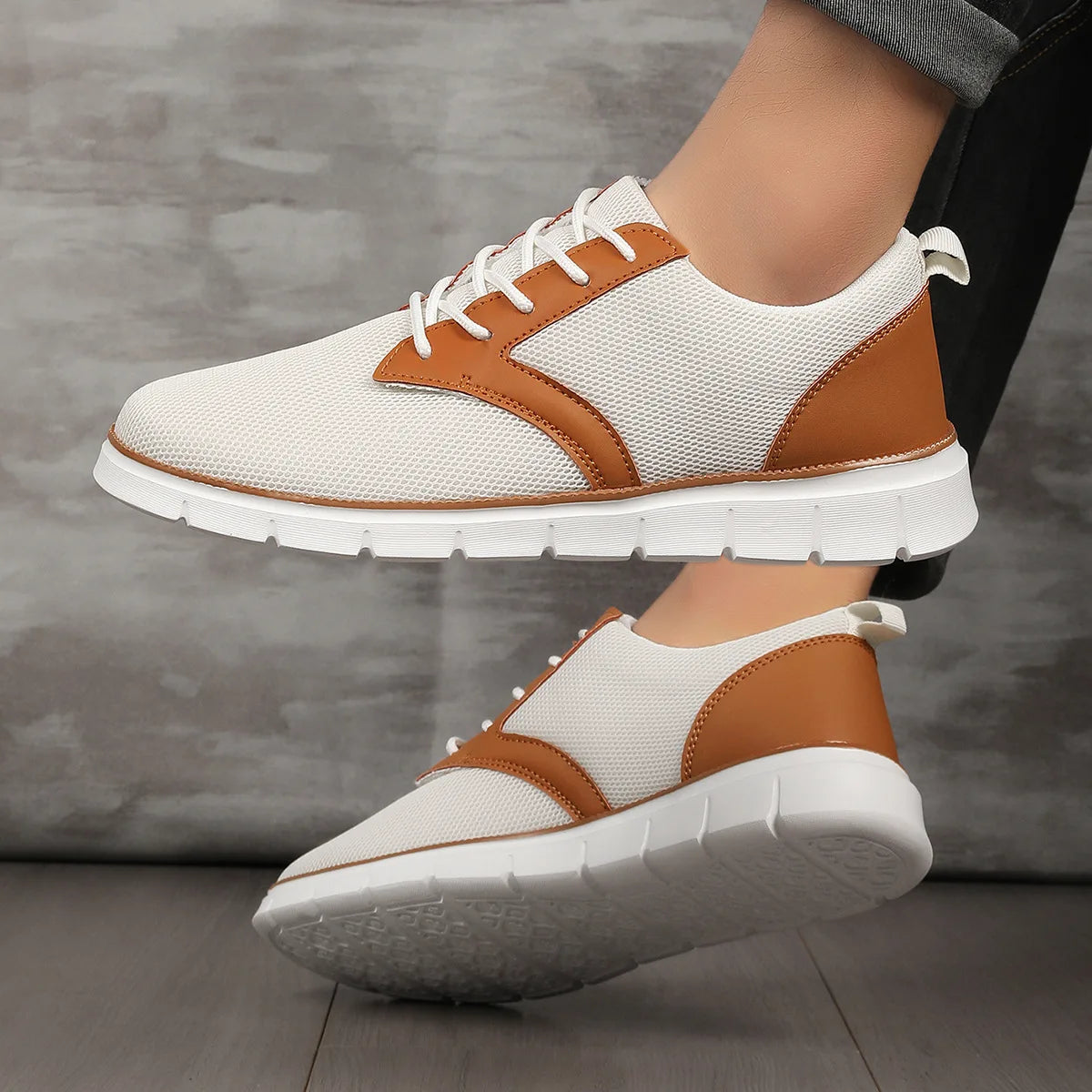 White and tan canvas leather orthopedic sneakers with lace-up closure and cushioned white sole, shown from side angles.