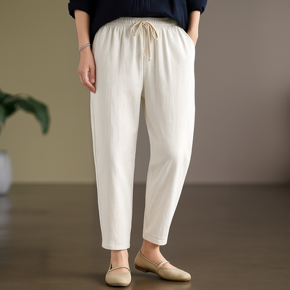 Women's beige linen drawstring tapered pants with elastic waist and relaxed fit for casual wear