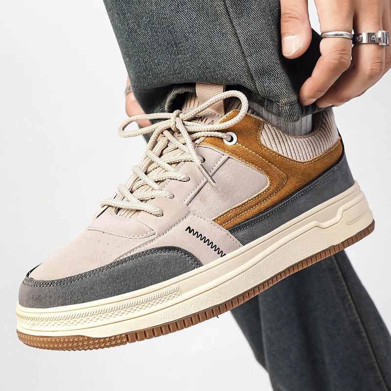 Men's patchwork low-top sneakers in beige, gray and tan with lace-up closure and chunky platform sole