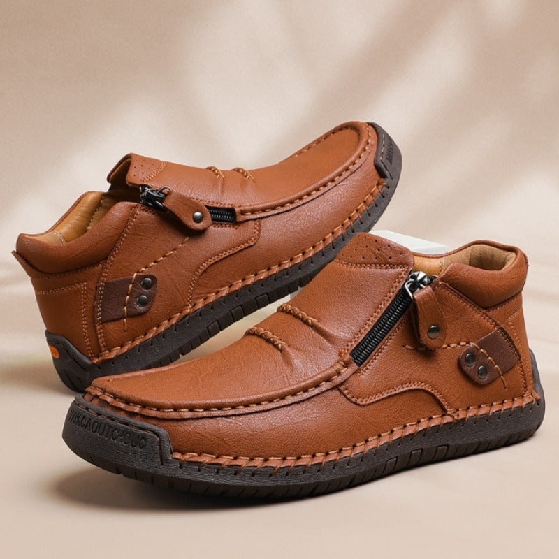 Men's brown leather slip-on ankle boots with side zipper and durable rubber sole