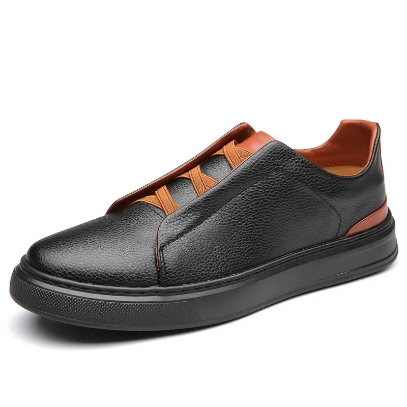 Black leather slip-on sneakers with elastic laces, brown contrast trim at heel and collar, flat rubber sole