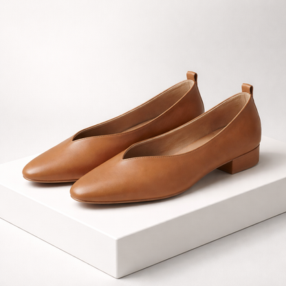 Women's tan brown Italian leather block heel orthopedic pumps with low heel on white display platform