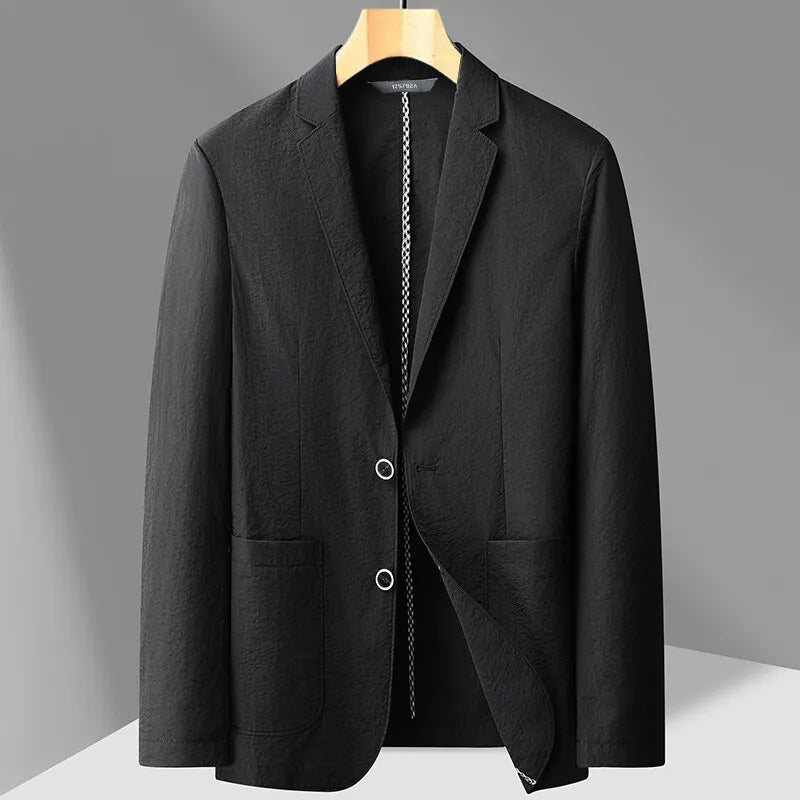 Black men's two-button blazer on wooden hanger with notch lapel, patch pockets, and textured fabric detail.