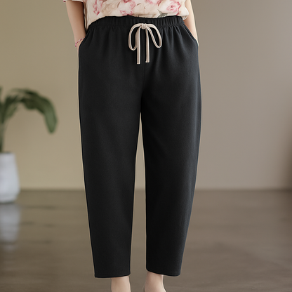 Black linen drawstring tapered pants for women with elastic waist and pockets, casual cropped length