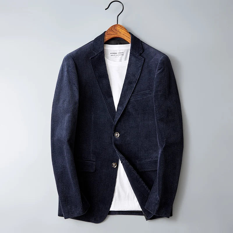 Navy blue corduroy men's blazer jacket with notch lapel, two buttons, and patch pockets on wooden hanger