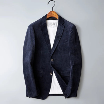 Navy blue corduroy men's blazer jacket with notch lapel, two buttons, and patch pockets on wooden hanger