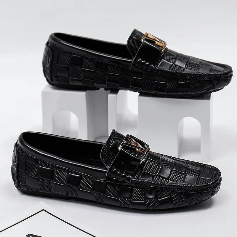Black checkered slip-on loafers for men with gold metal buckle detail and textured pattern driving moccasins