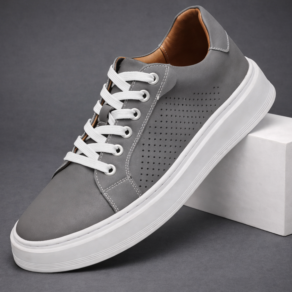 Gray men's leather lace-up sneakers with perforated side detail, white sole, and tan interior lining.