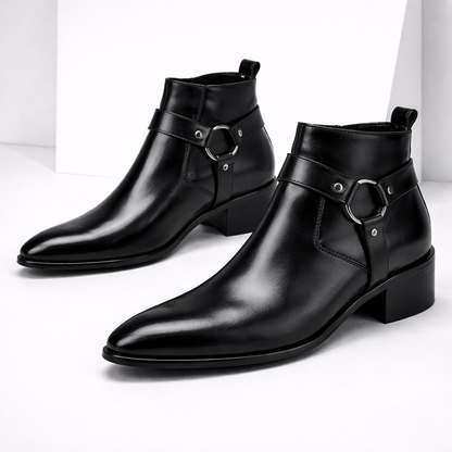 Black leather men's ankle boots with silver harness ring detail, pointed toe, block heel, and side zipper closure.