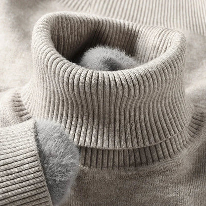Men's merino wool turtleneck sweater in beige with ribbed knit texture and soft fleece-lined collar detail.