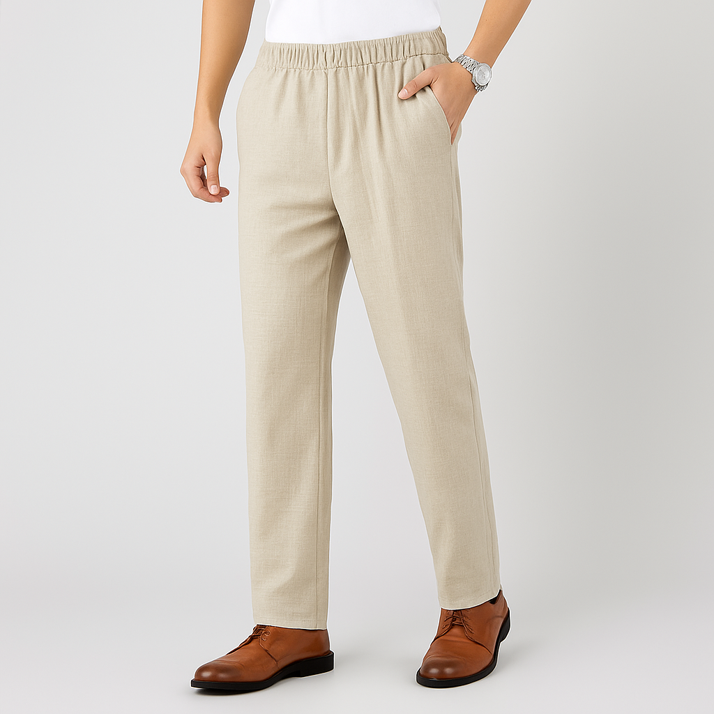 Man wearing beige linen drawstring pants with elastic waist, paired with brown leather dress shoes and a silver watch.