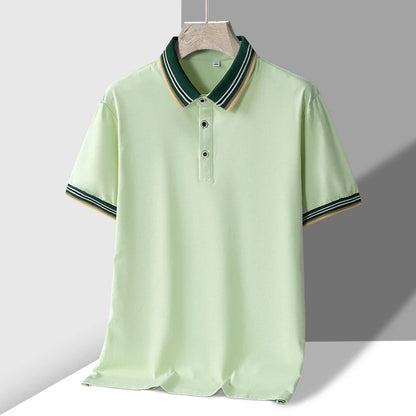 Light green men's polo shirt with striped green, white, and tan tipped collar and matching sleeve cuffs, short sleeves