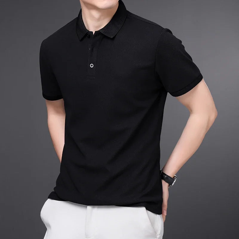 Men's black cotton polo shirt with short sleeves, button placket, and collared neckline, paired with white pants.